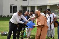 HH Swamiji plants a Rudraksha sapling in the courtyard arena, symbolizing spiritual growth and environmental consciousness